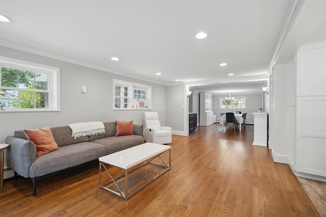 8 Clinton Ct, Monroe, NY 10950 - living area featuring recessed lighting, wood finished floors, ornamental molding, a chandelier, and baseboards