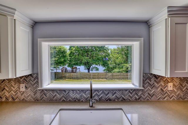 8 Clinton Ct, Monroe, NY 10950 - kitchen with a sink, white cabinets, and tasteful backsplash