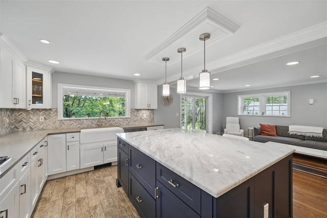 8 Clinton Ct, Monroe, NY 10950 - kitchen featuring white cabinetry, light wood finished floors, tasteful backsplash, a sink, and recessed lighting