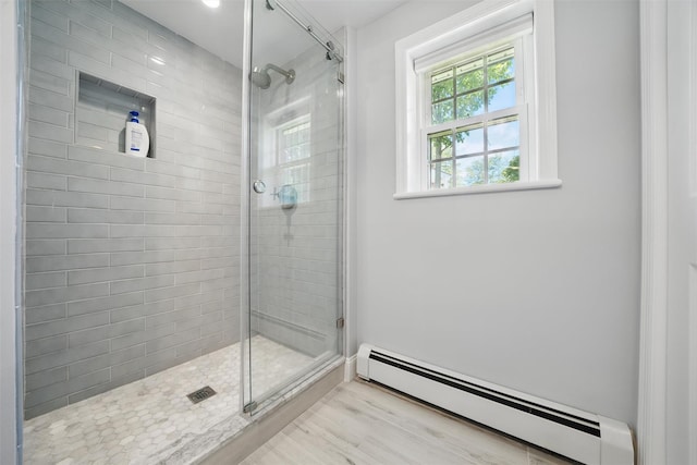 8 Clinton Ct, Monroe, NY 10950 - bathroom with a baseboard radiator, a shower stall, and wood finished floors