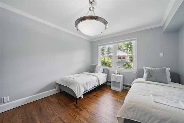 8 Clinton Ct, Monroe, NY 10950 - bedroom with ornamental molding, a baseboard heating unit, baseboards, and wood finished floors