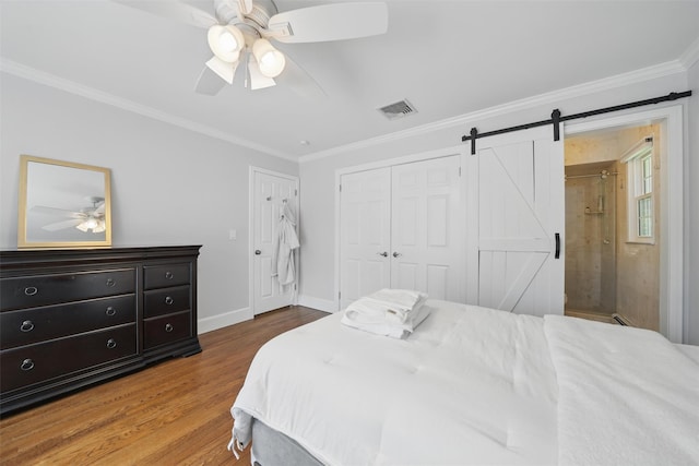8 Clinton Ct, Monroe, NY 10950 - bedroom featuring wood finished floors, ornamental molding, baseboards, a barn door, and a ceiling fan