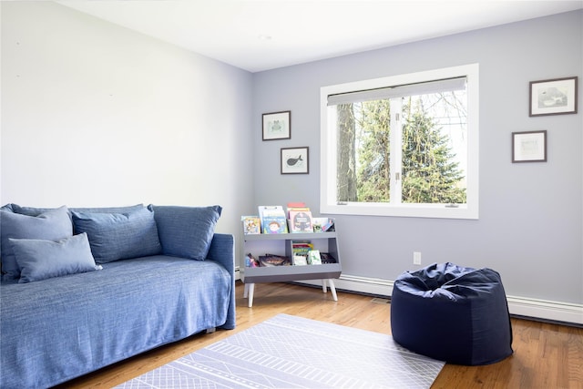 2865 S Harbor Rd, Southold, NY 11971 - bedroom with a baseboard heating unit and wood finished floors