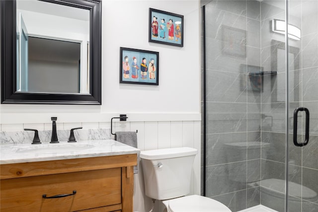 2865 S Harbor Rd, Southold, NY 11971 - bathroom with toilet, vanity, a stall shower, and wainscoting