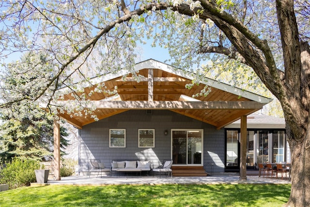 2865 S Harbor Rd, Southold, NY 11971 - back of house with an outdoor living space, a patio area, and a lawn