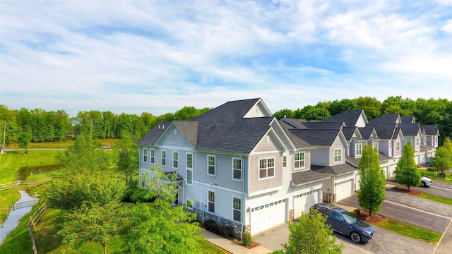 1 Lindentree Ln, Middletown, NY 10940 - view of side of home with asphalt driveway, an attached garage, and stone siding