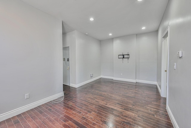5130 35th St, Long Island City, NY 11101 - empty room with dark wood-type flooring, baseboards, and recessed lighting