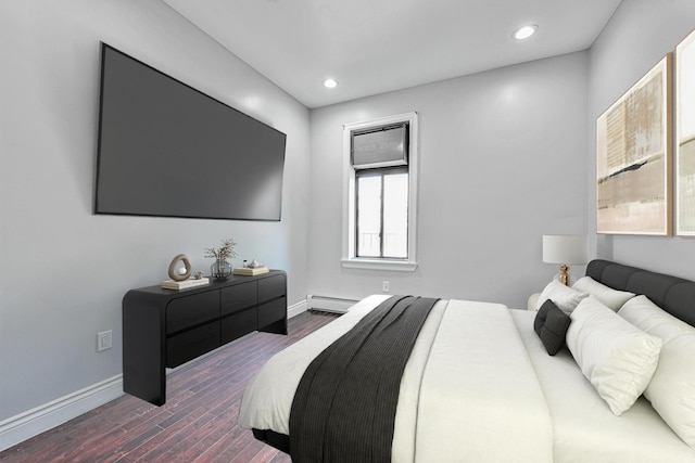 5130 35th St, Long Island City, NY 11101 - bedroom featuring a baseboard heating unit, dark wood-style floors, baseboards, and recessed lighting