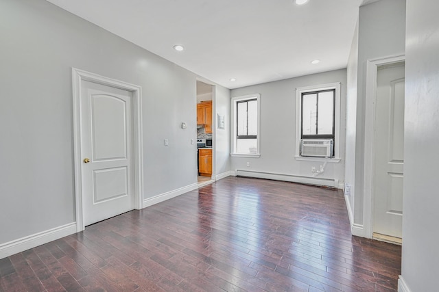 5130 35th St, Long Island City, NY 11101 - empty room with baseboard heating, dark wood-style flooring, cooling unit, baseboards, and recessed lighting