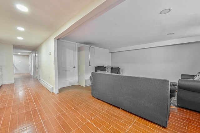 5130 35th St, Long Island City, NY 11101 - unfurnished living room featuring baseboard heating, recessed lighting, baseboards, and light wood-type flooring