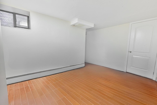5130 35th St, Long Island City, NY 11101 - empty room with a baseboard radiator and wood finished floors