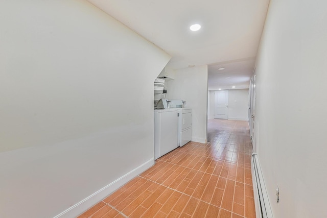 5130 35th St, Long Island City, NY 11101 - hall with washing machine and dryer, baseboard heating, recessed lighting, and baseboards
