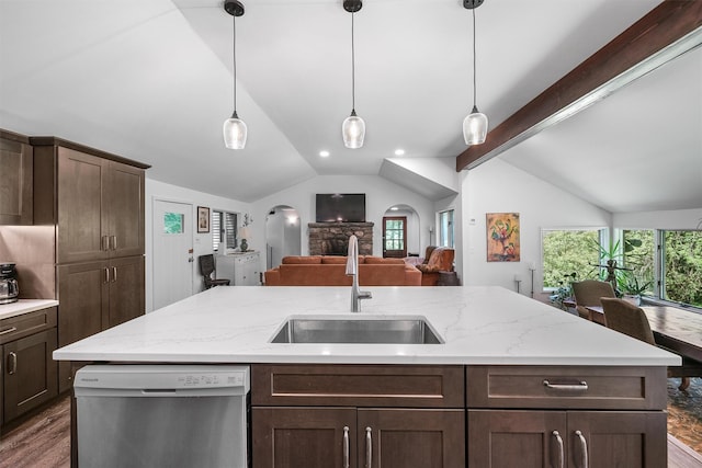 42 Raspberry Ln, Carmel, NY 10512 - kitchen with stainless steel dishwasher, a sink, arched walkways, open floor plan, and dark wood finished floors