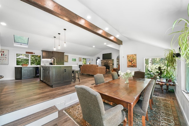 42 Raspberry Ln, Carmel, NY 10512 - dining room featuring dark wood-style flooring, plenty of natural light, baseboards, recessed lighting, and a stone fireplace