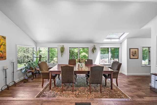 42 Raspberry Ln, Carmel, NY 10512 - dining space featuring a skylight, wood finished floors, vaulted ceiling, and baseboards