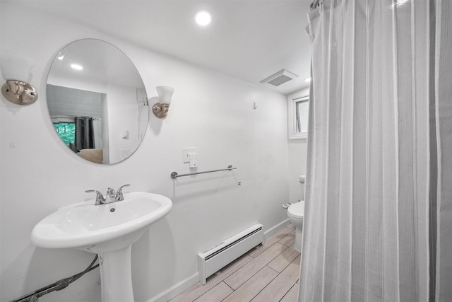 42 Raspberry Ln, Carmel, NY 10512 - full bath with a baseboard radiator, toilet, baseboards, recessed lighting, and wood tiled floors