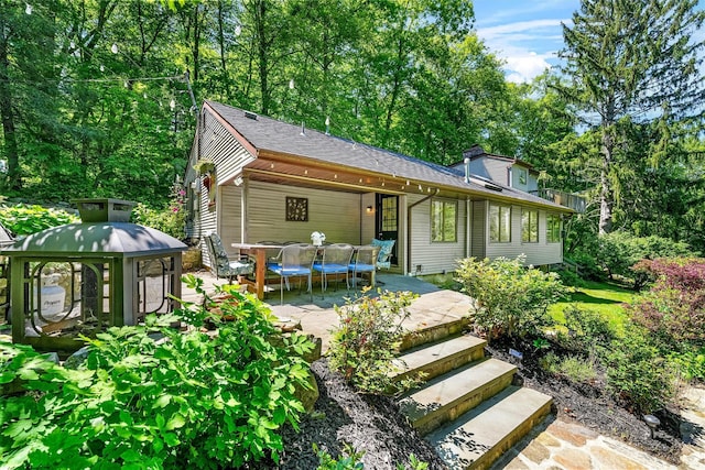 42 Raspberry Ln, Carmel, NY 10512 - back of property featuring a patio and roof with shingles