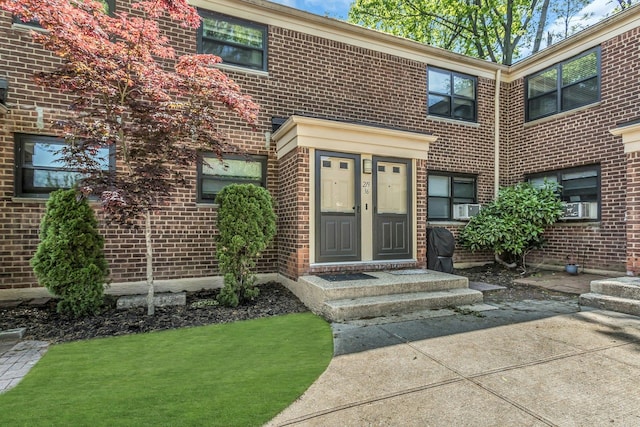 219-36 75th Ave Unit 243A2, Bayside, NY 11364 - doorway to property featuring brick siding and cooling unit