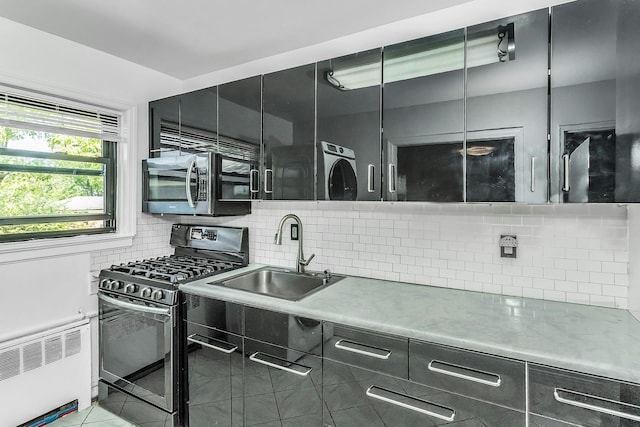 219-36 75th Ave Unit 243A2, Bayside, NY 11364 - kitchen with appliances with stainless steel finishes, a sink, radiator, and dark cabinets