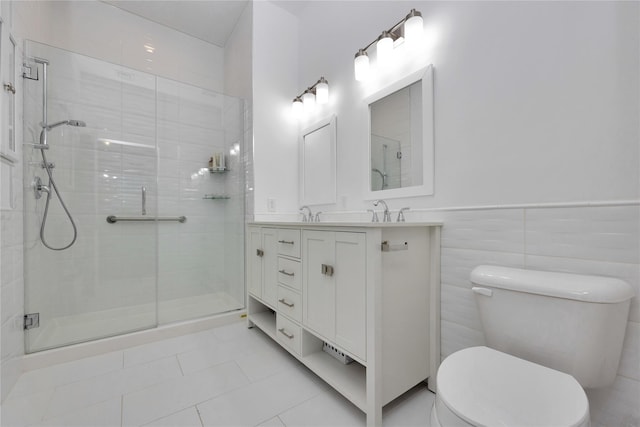 308 Breton Way Unit 308, Glen Cove, NY 11542 - bathroom featuring toilet, a stall shower, tile patterned flooring, double vanity, and a wainscoted wall