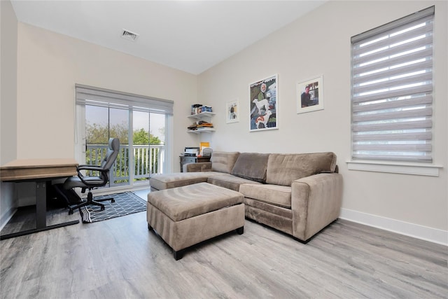 308 Breton Way Unit 308, Glen Cove, NY 11542 - living room featuring light wood-style floors, baseboards, and an office area