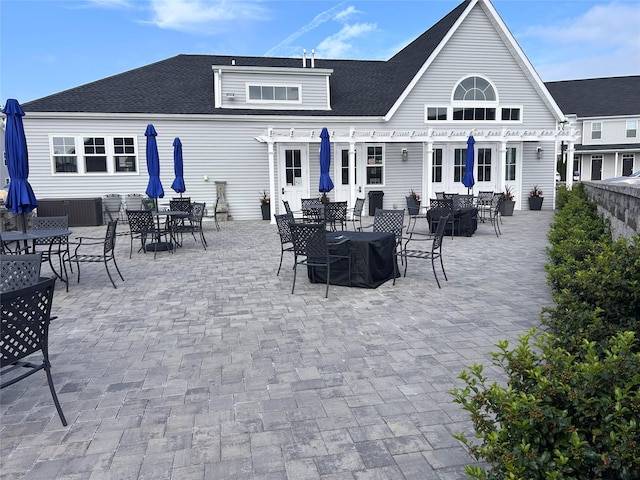 308 Breton Way Unit 308, Glen Cove, NY 11542 - rear view of house with outdoor dining area, a pergola, and roof with shingles