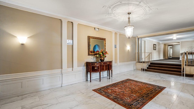 90 Knightsbridge Rd Unit H 1, Great Neck, NY 11021 - community lobby featuring crown molding, a decorative wall, stairway, and wainscoting