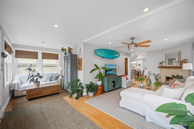 49 Oregon St, Long Beach, NY 11561 - living area featuring wood finished floors, recessed lighting, a ceiling fan, and a fireplace
