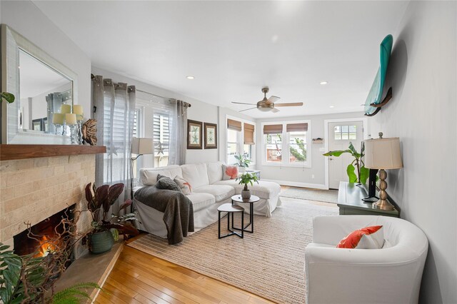49 Oregon St, Long Beach, NY 11561 - living area with hardwood / wood-style flooring, ceiling fan, recessed lighting, baseboards, and a brick fireplace
