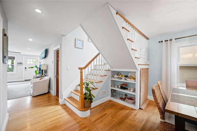 49 Oregon St, Long Beach, NY 11561 - staircase featuring wood-type flooring, baseboards, and recessed lighting