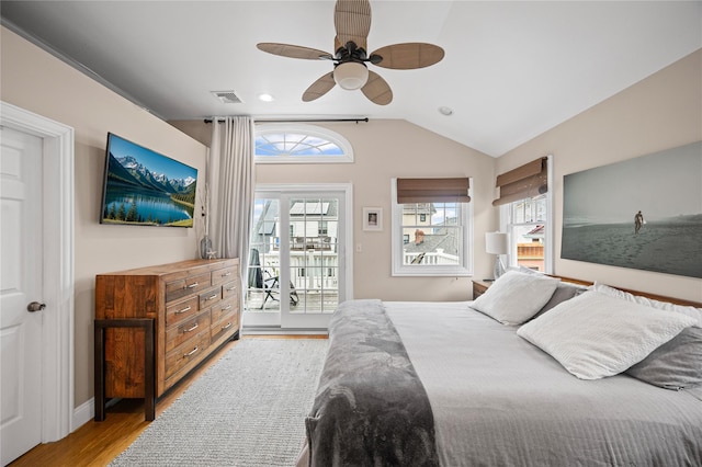 49 Oregon St, Long Beach, NY 11561 - bedroom featuring access to exterior, wood finished floors, vaulted ceiling, and a ceiling fan