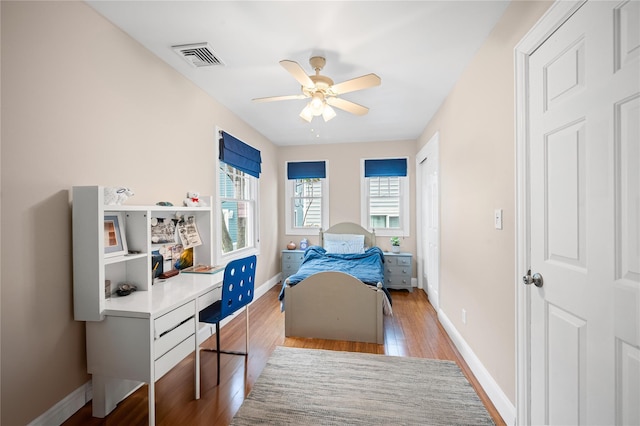 49 Oregon St, Long Beach, NY 11561 - bedroom with wood finished floors, baseboards, and a ceiling fan