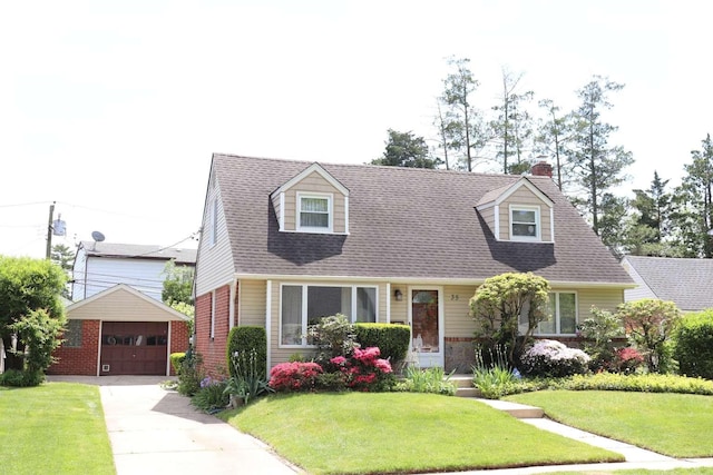 cape cod house with an outbuilding, a garage, a front lawn, brick siding, and a chimney