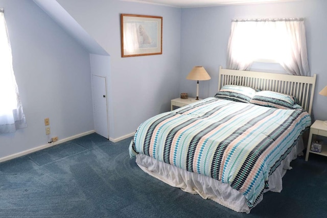 bedroom with carpet flooring and baseboards