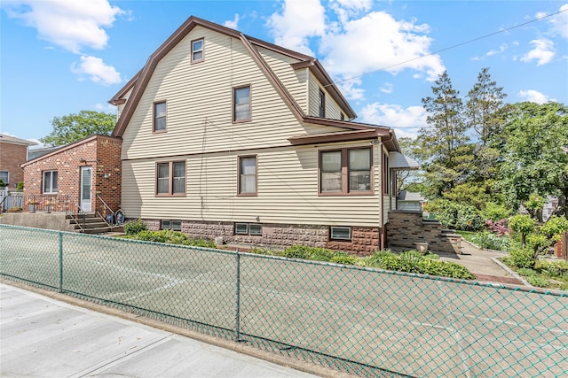 view of property exterior featuring fence
