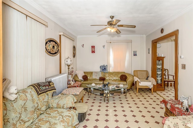 living room featuring ceiling fan, radiator, and ornamental molding