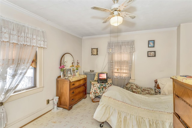 bedroom featuring ornamental molding, radiator heating unit, and a ceiling fan