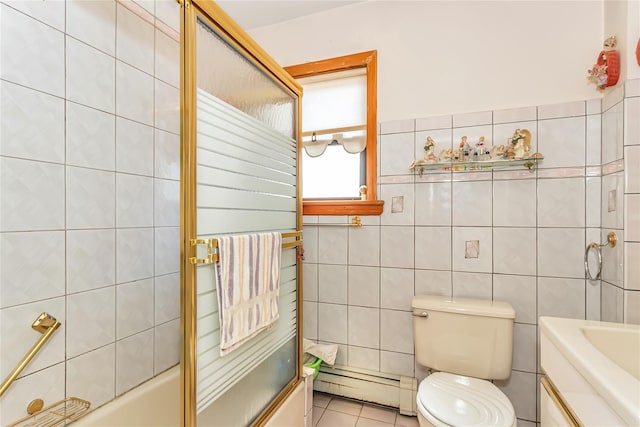 full bath with a baseboard radiator, tile walls, shower / bath combination with glass door, toilet, and tile patterned floors