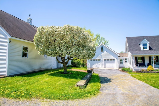 535 Upper Brown Rd, Call Listing Agent, NY 12066 - view of front facade featuring asphalt driveway, a front yard, a garage, and a porch