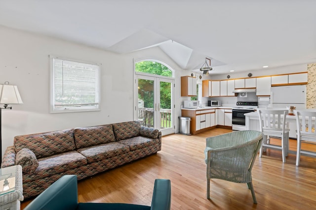 90 Cocks Ln, Locust Valley, NY 11560 - living room with vaulted ceiling, light wood-type flooring, and recessed lighting