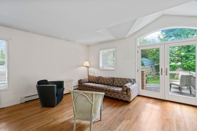 90 Cocks Ln, Locust Valley, NY 11560 - living area with baseboard heating, healthy amount of natural light, light wood-style floors, and lofted ceiling
