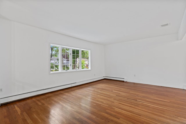90 Cocks Ln, Locust Valley, NY 11560 - unfurnished room featuring wood finished floors and baseboard heating