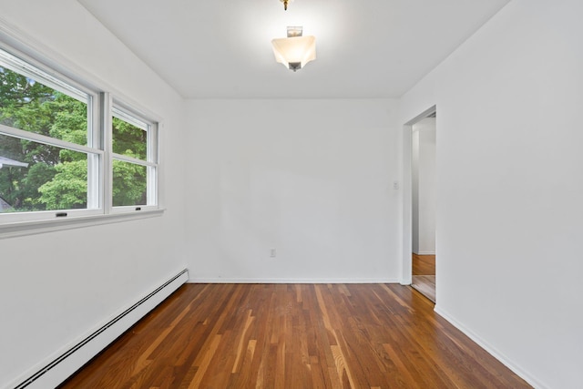 90 Cocks Ln, Locust Valley, NY 11560 - unfurnished room with a baseboard radiator, wood finished floors, and baseboards