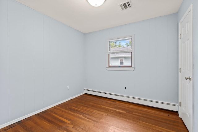 90 Cocks Ln, Locust Valley, NY 11560 - spare room featuring baseboard heating, wood finished floors, and baseboards