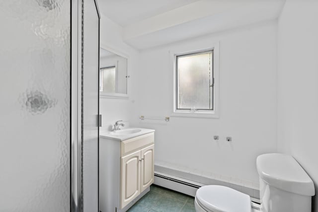 90 Cocks Ln, Locust Valley, NY 11560 - full bath featuring baseboard heating, toilet, vanity, tile patterned floors, and a shower with shower door