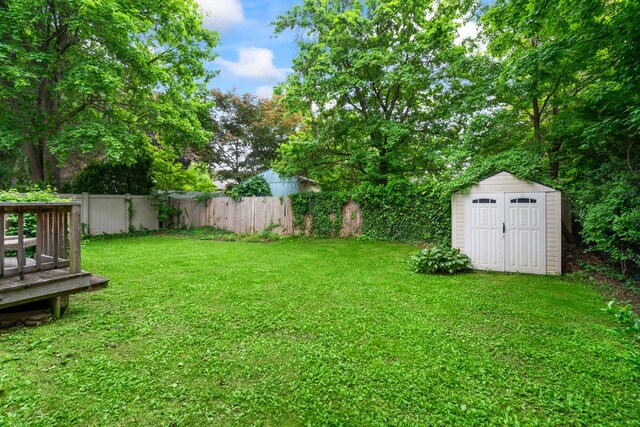 90 Cocks Ln, Locust Valley, NY 11560 - view of yard featuring a shed, an outbuilding, and a deck