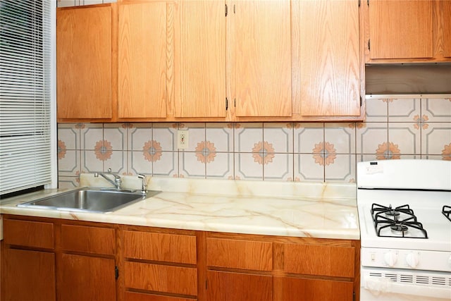 808 Bronx River Rd Unit 1A, Yonkers, NY 10708 - kitchen featuring white gas range, a sink, light countertops, and decorative backsplash