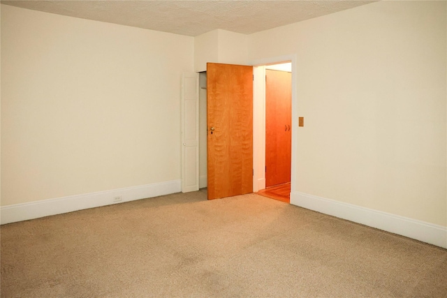 808 Bronx River Rd Unit 1A, Yonkers, NY 10708 - unfurnished room featuring light carpet, a textured ceiling, and baseboards
