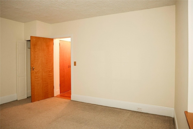 808 Bronx River Rd Unit 1A, Yonkers, NY 10708 - spare room with carpet flooring, a textured ceiling, and baseboards