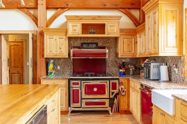kitchen with tasteful backsplash, wooden counters, dishwasher, and light wood-type flooring